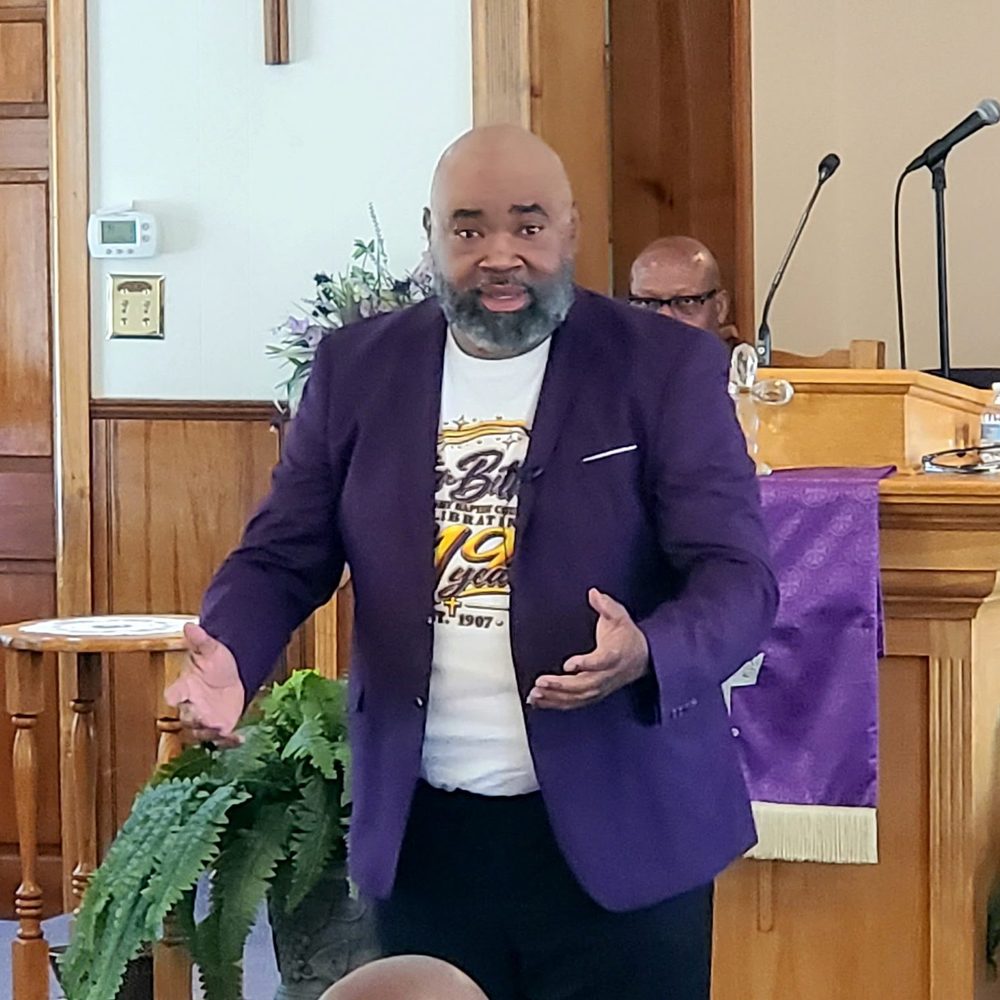 Pastor Marvin Parks preaching from the pulpit at Star Bethel