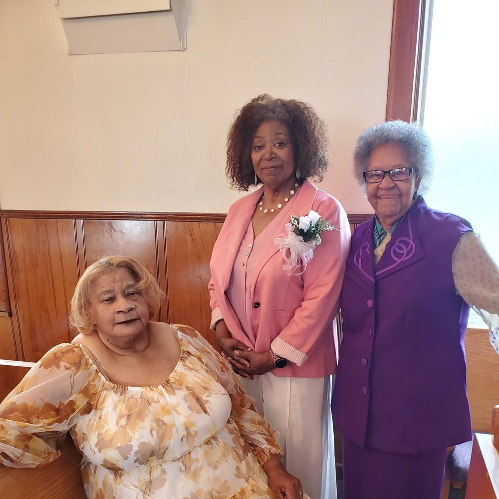 Three women of the church together after worship