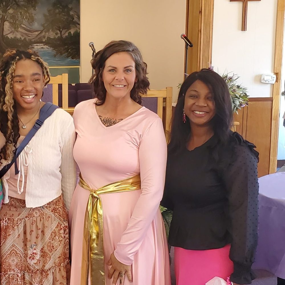 Three women of Star Bethel dressed for Sunday worship